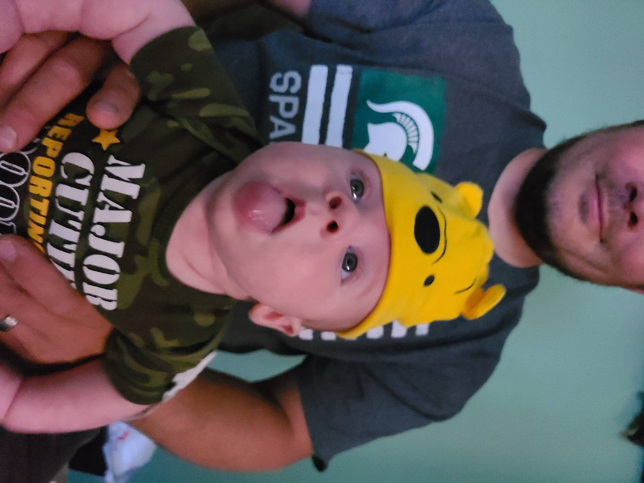 Charlie is registered to the contest to win money with this photo: baby, baby_products, baby_toddler_clothing, cheek, child, comfort, eyelash, facial_expression, finger, fun, happy, head, headwear, mouth, nail, person, sleeve, thumb, toddler, wrist