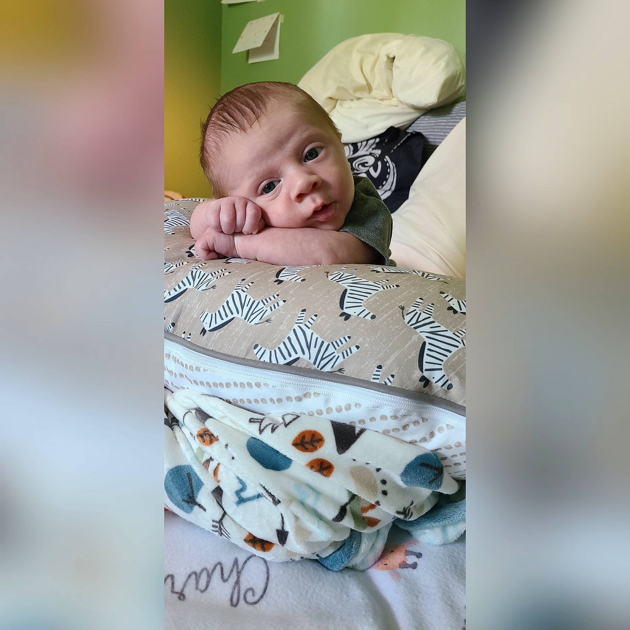 Charlie is registered to the contest to win money with this photo: baby, baby_products, baby_toddler_clothing, child, comfort, face, fashion_accessory, happy, head, linens, paper, paper_product, pattern, people_in_nature, person, photo_caption, photomontage, picture_frame, portrait, portrait_photography