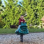 child, playground, spring_rocker, green, frog, smiling, happy, outdoor, grass, trees, wood_chips, casual_clothing, jeans, red_shirt, daylight, fun, play, recreation, person, park