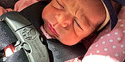Vada joined the competition — help win amazing prizes! baby, car, car_interior, carseat, clothing, cushion, electronics, face, glove, gun, head, homedecor, newborn, person, photography, portrait, sleeping, transportation, vehicle, weapon