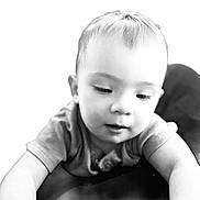 Ellie is registered to the contest to win money with this photo: child, toddler, baby, face, portrait, black_and_white, close_up, curious, expression, soft_lighting, short_hair, clothing, sleeve, skin, young, person, indoor, monochrome, cute, innocent