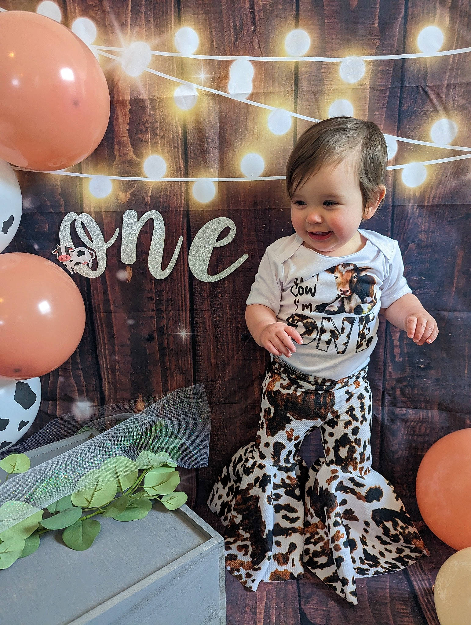 Taylor is registered to the contest to win money with this photo: baby, baby_toddler_clothing, ball, balloon, beauty, child, event, flash_photography, flooring, font, fun, happy, metal, party_supply, pattern, person, sleeve, smile, snapshot, t_shirt