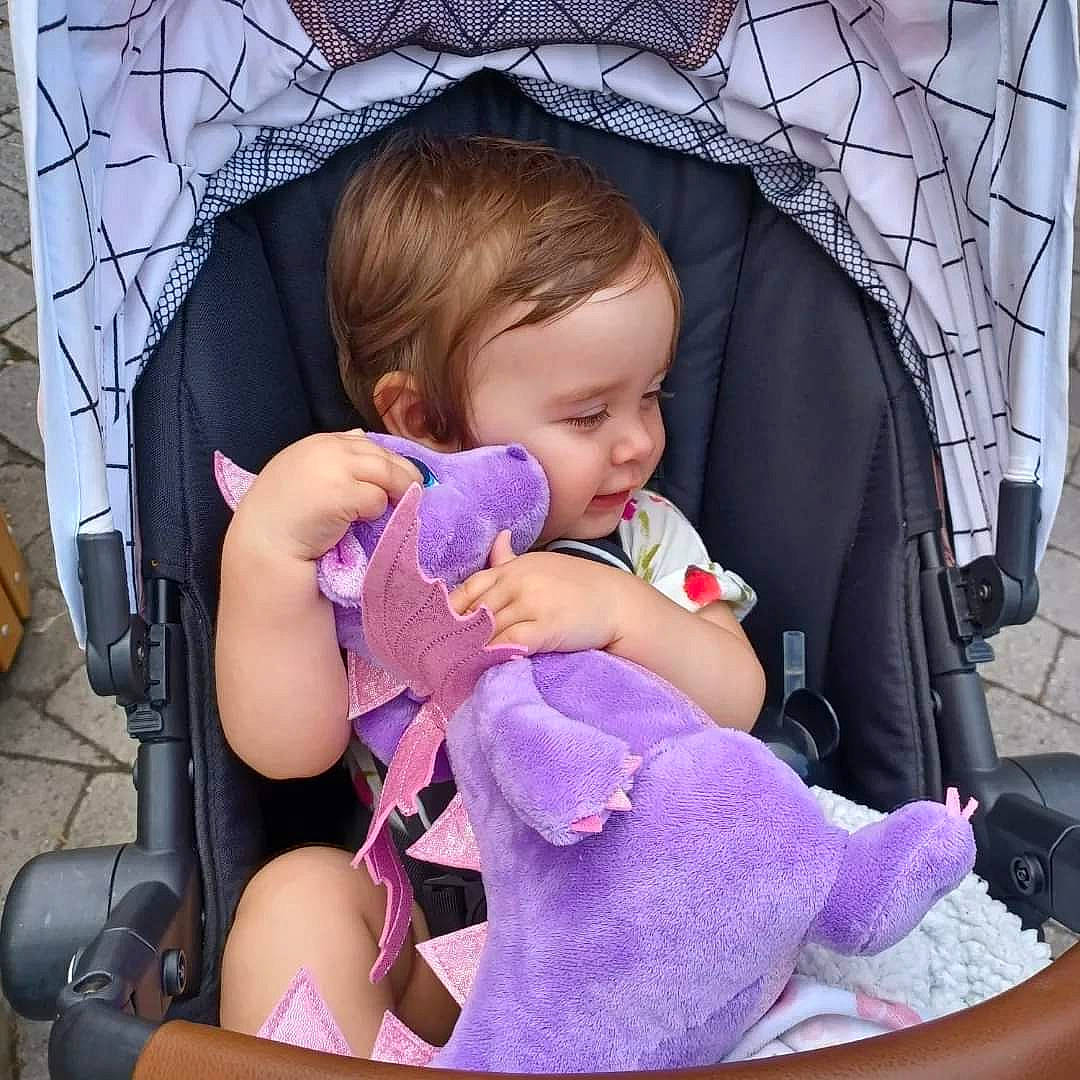 Taylor joined the competition — help win amazing prizes! baby, baby_carriage, baby_products, baby_sleeping, baby_toddler_clothing, car_seat, cheek, child, comfort, facial_expression, fun, hairstyle, lap, mouth, person, product, purple, sitting, skin, toddler