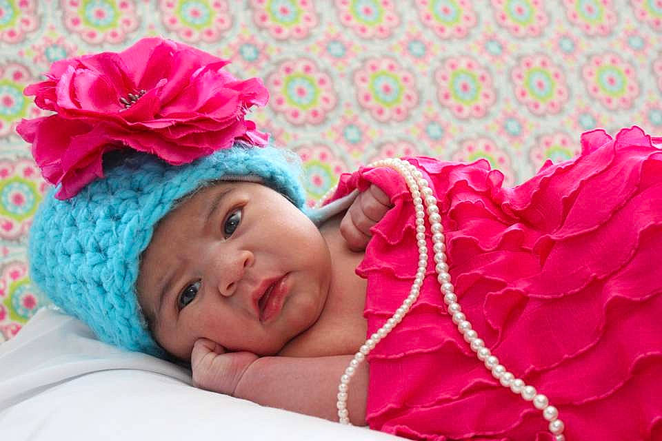 Annabella is registered to the contest to win money with this photo: child, flower, girl, hair_accessory, headgear, headwear, infant, magenta, person, petal, pink, product, rose, rose_family, rose_order, smile, toddler