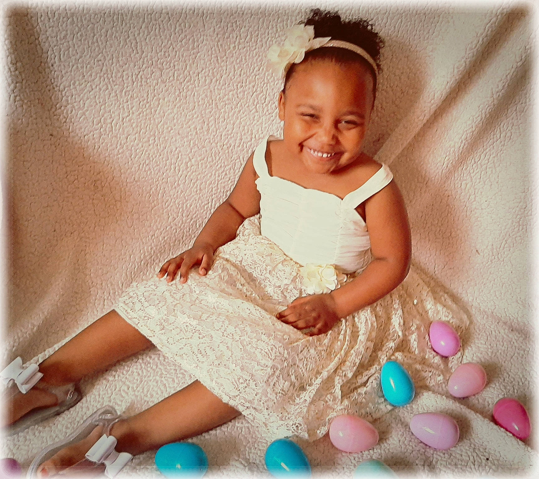 Kimani is registered to the contest to win money with this photo: baby, baby_products, baby_sleeping, baby_toddler_clothing, child, child_model, costume, dress, hair_accessory, happy, joy, linens, person, photography, pink, product, shoe, sitting, skin, textile