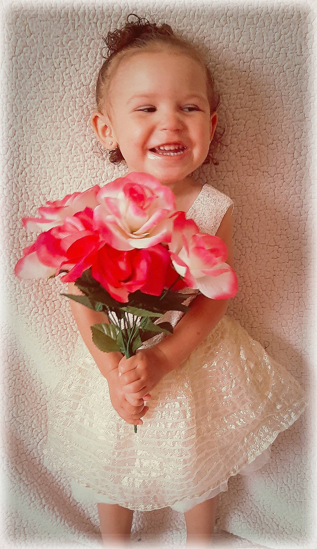 Lyrical is registered to the contest to win money with this photo: baby, baby_toddler_clothing, bouquet, cheek, child, cut_flowers, facial_expression, fashion_accessory, flower, garden_roses, happy, joy, nose, person, petal, pink, plant, rose, rose_family, rose_order