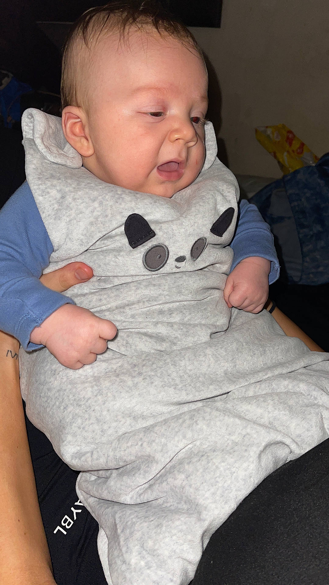 Arlo Bleu is registered to the contest to win money with this photo: accessories, baby, blanket, bodypart, bracelet, clothing, face, finger, hand, head, jewelry, knitwear, newborn, pants, person, photography, portrait, sweater, sweatshirt, t_shirt