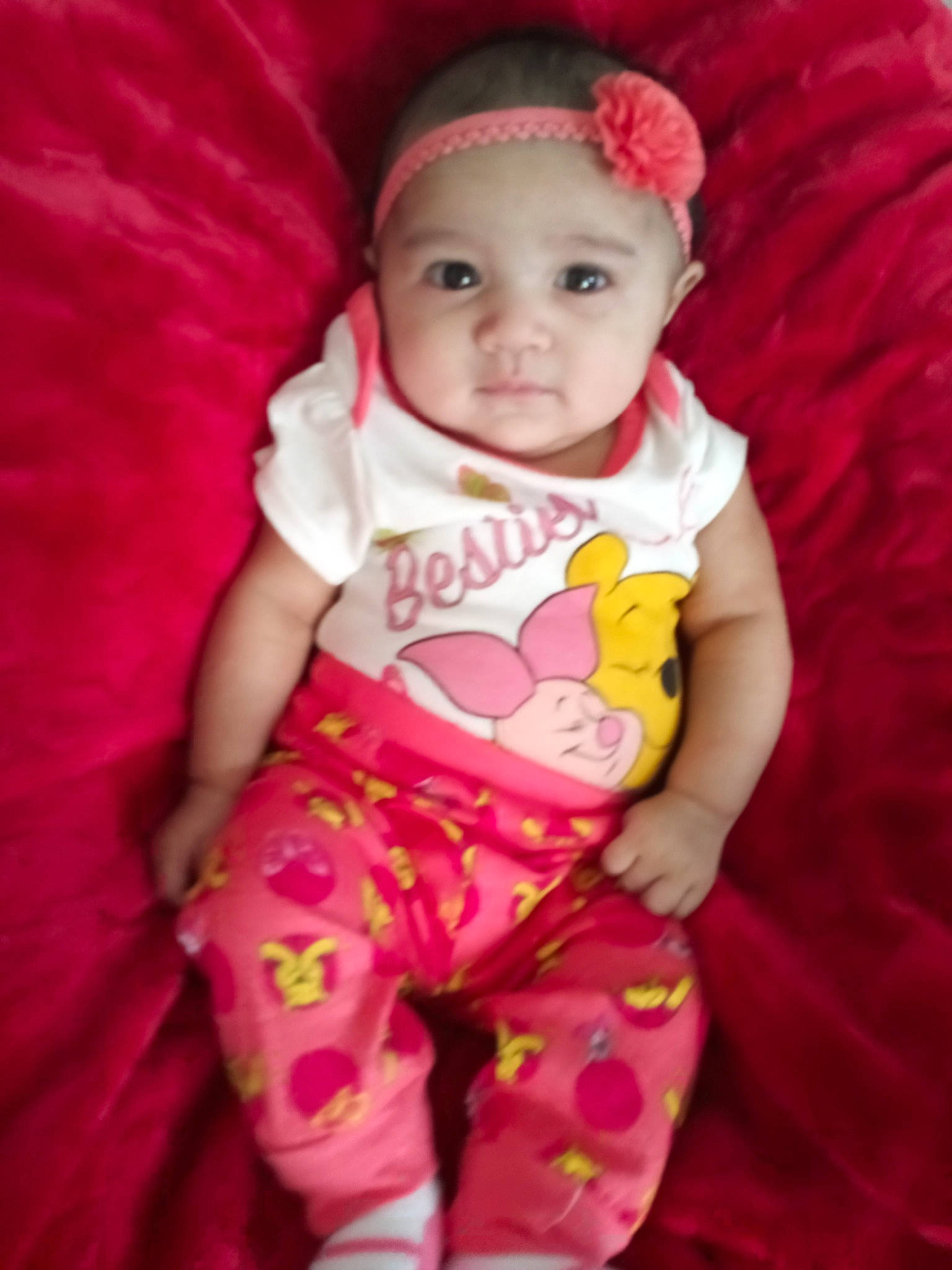 Ayva is registered to the contest to win money with this photo: baby, baby_products, baby_toddler_clothing, cheek, child, hair_accessory, lip, magenta, person, pink, product, skin, smile, toddler