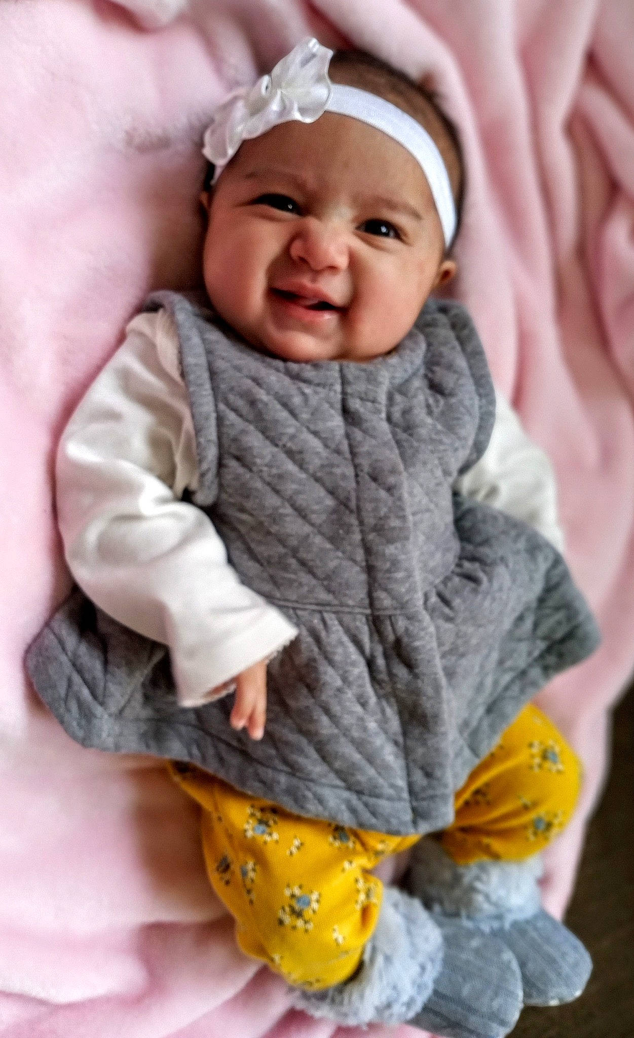 Ayva is registered to the contest to win money with this photo: baby, baby_sleeping, cheek, child, ear, headwear, outerwear, person, skin, smile, textile, toddler, wool, yellow