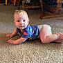 Nathaniel joined the competition — help win amazing prizes! baby, infant, carpet, floor, diaper, shirt, dinosaur_pattern, toy_ball, wooden_furniture, legs, indoor, child, person, crawling, looking, curious, home, carpeted_floor, blue_shirt, barefoot