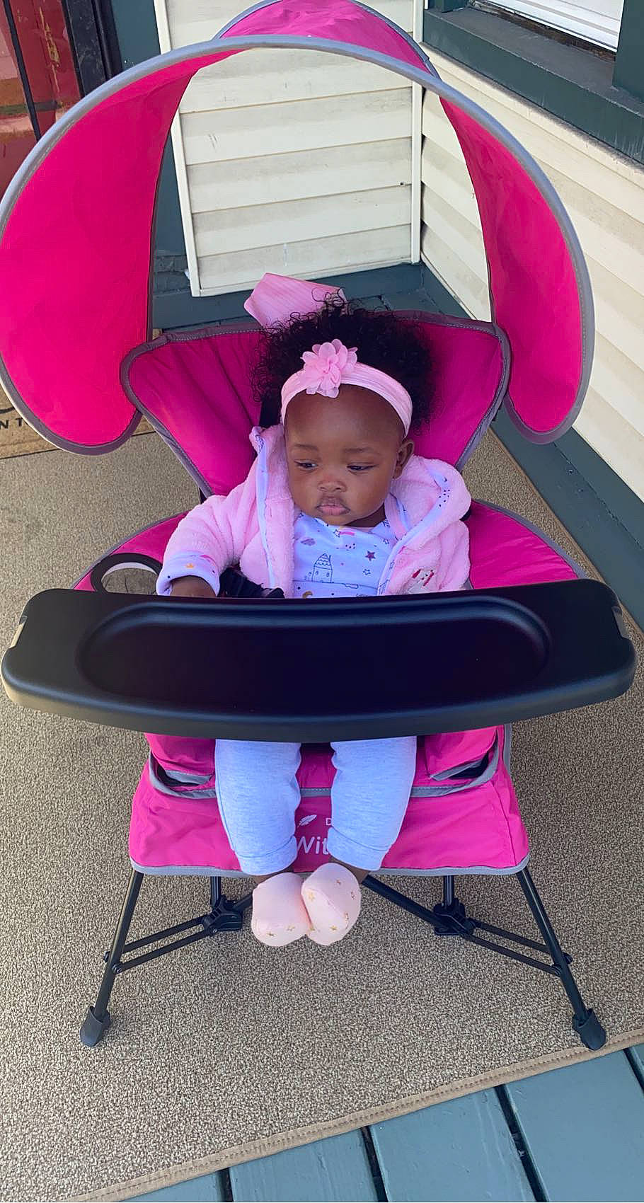 Neilani is registered to the contest to win money with this photo: baby, baby_products, baby_toddler_clothing, chair, child, comfort, cool, fashion_accessory, lap, leisure, magenta, outdoor_furniture, person, pink, purple, recreation, red, sitting, toddler, violet