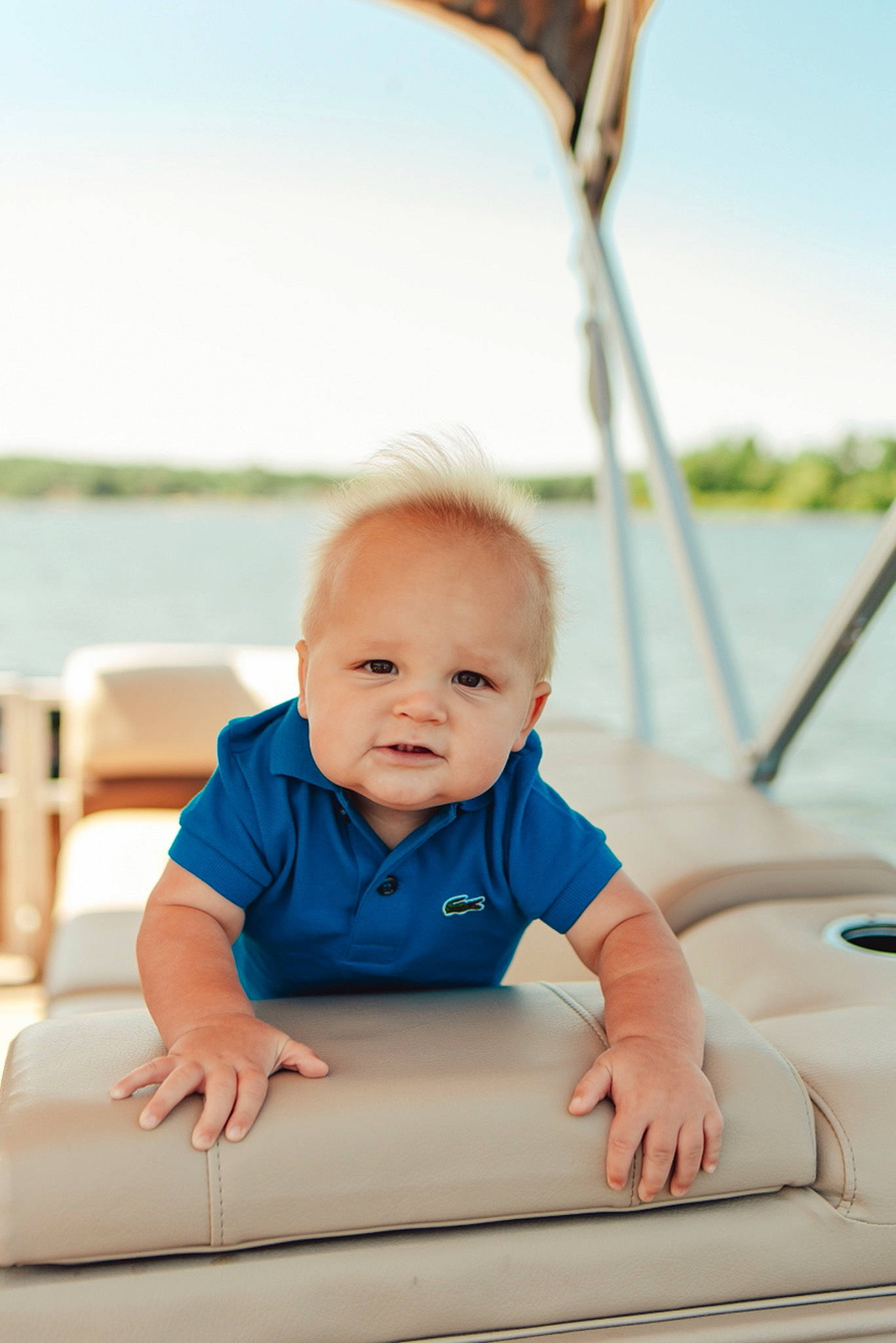 Jaxon is registered to the contest to win money with this photo: azure, baby, baby_toddler_clothing, cheek, child, comfort, facial_expression, flash_photography, fun, grass, happy, leisure, person, recreation, sitting, skin, sky, sleeve, toddler, water