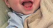 élouan participe au concours pour gagner de l'argent avec cette photo : baby, blanket, blue_shirt, car_seat, cheek, child, close_up, cute, ear, face, furniture, hand, happy, infant, laughing, portrait, seat, smiling, teething_ring, toy