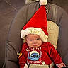 élouan participe au concours pour gagner de l'argent avec cette photo : baby, baby_seat, bouncer_seat, christmas, cozy, festive, formula_baby, hat_brim, holiday_outfit, infant, newborn, pacifier_clip, plush, portrait, red_clothing, santa_hat, smiling, stitch_character, strap, tiled_floor