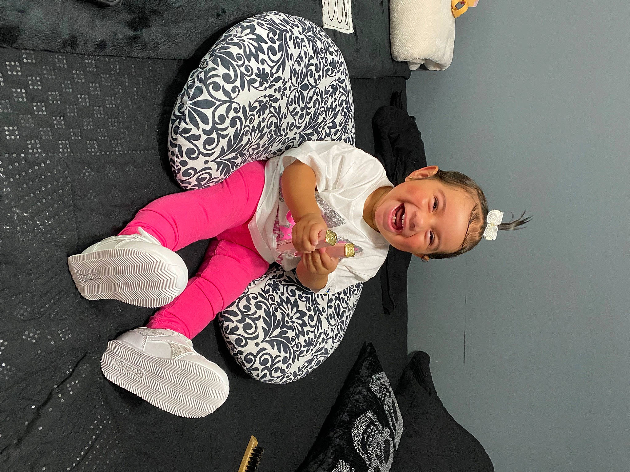 Alyssa is registered to the contest to win money with this photo: comfort, elbow, fashion_design, flash_photography, fun, gesture, happy, human_leg, knee, magenta, pattern, person, room, sitting, sleeve, smile, t_shirt, thigh, wrist