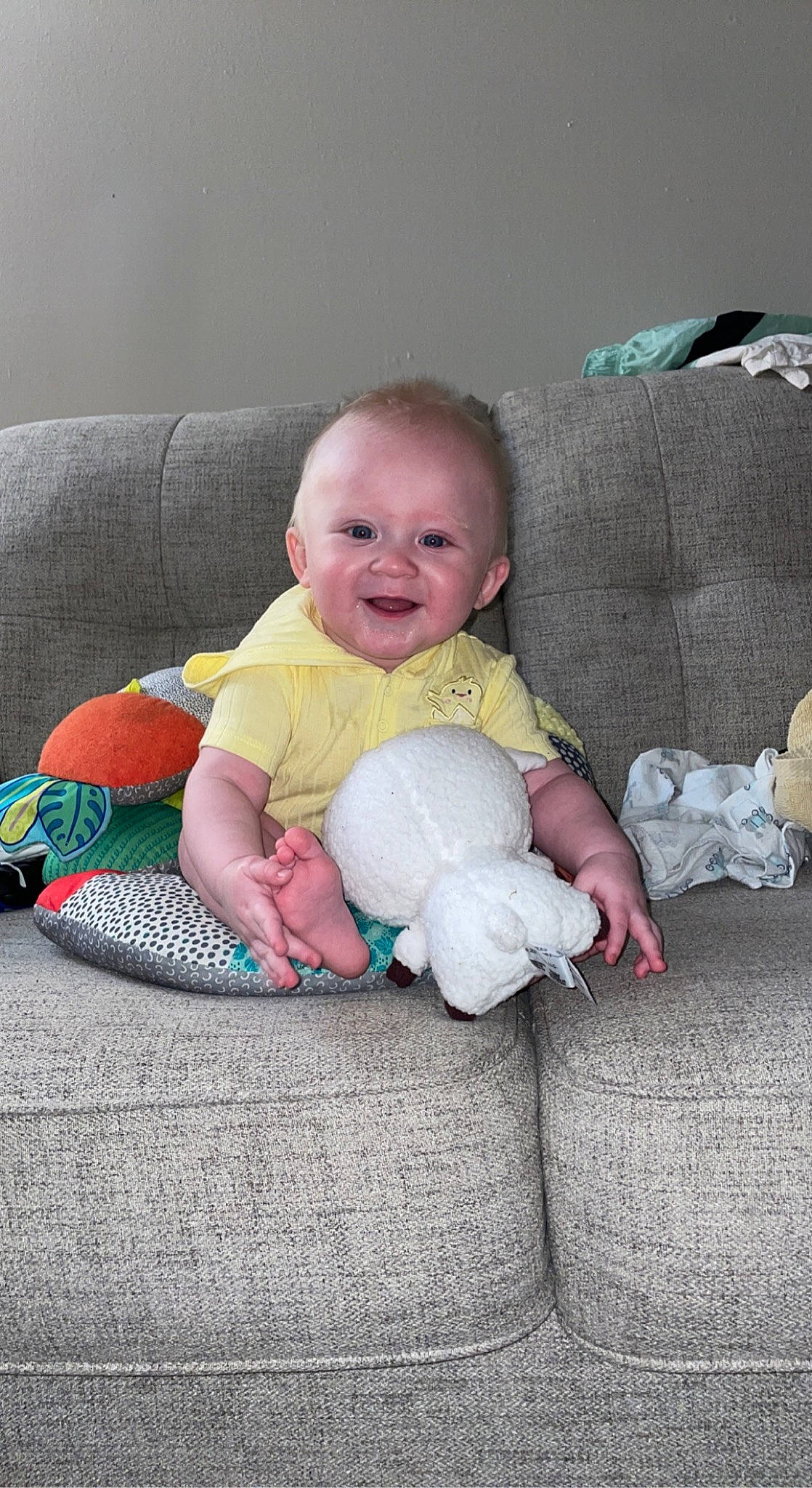 Khai-mateo is registered to the contest to win money with this photo: baby, baby_toddler_clothing, cheek, child, comfort, couch, eye, face, flash_photography, flooring, fun, grass, happy, head, lap, person, room, sitting, skin, smile