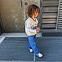 Isaïah participe au concours pour gagner de l'argent avec cette photo : brown_hair, casual, child, concrete, curly_hair, daylight, door, fashion, jeans, metal_grate, outdoor, person, side_view, sneakers, street_style, sunglasses, sweater_vest, urban, walking, young