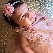 Scarlett joined the competition — help win amazing prizes! baby, infant, girl, pink_dress, headband, flower, smile, sparkle, glitter, happy, portrait, cute, child, tulle, fabric, skin, closeup, lying_down, soft_lighting, adorable
