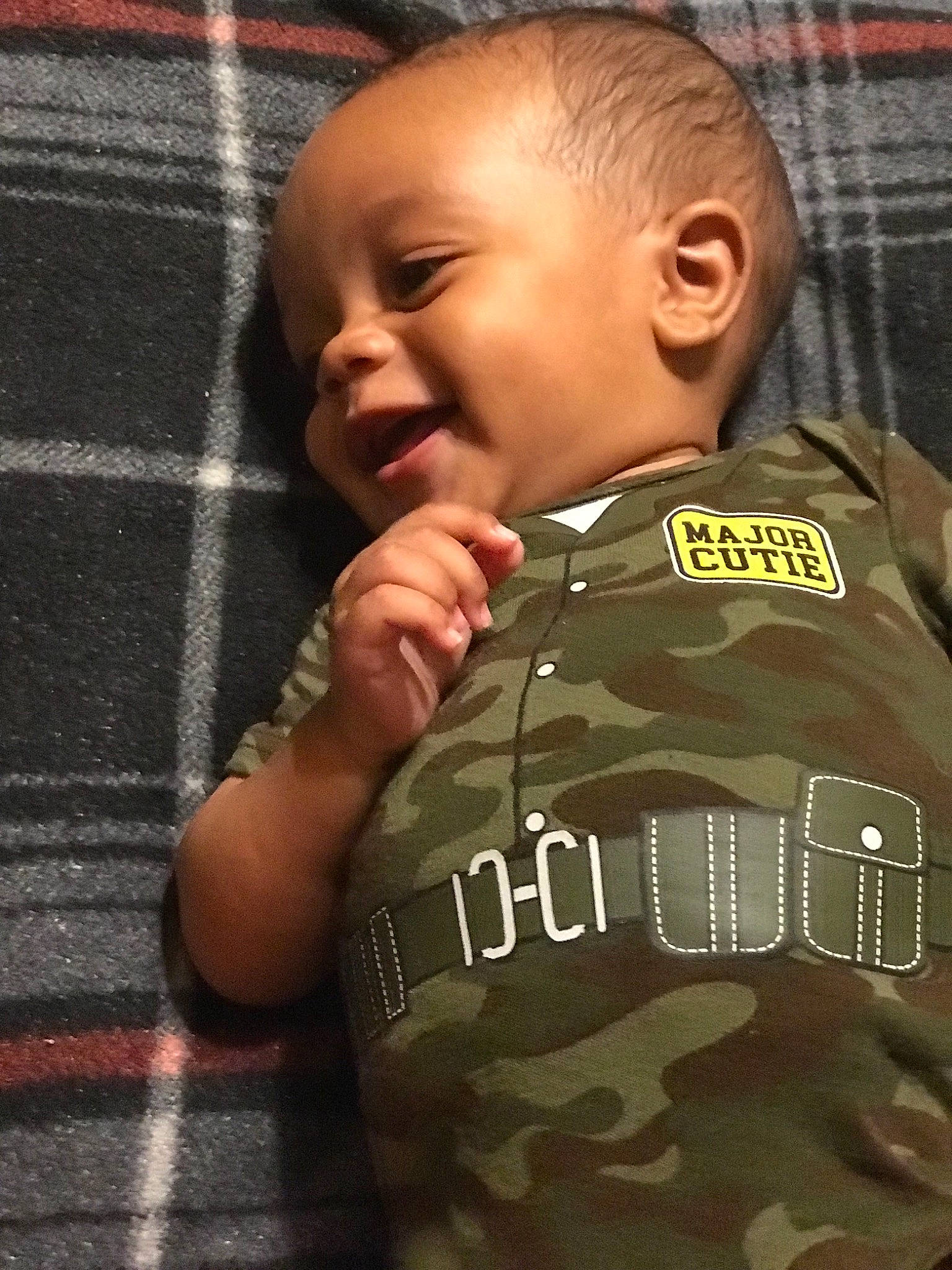 Jermaine is registered to the contest to win money with this photo: arm, baby, camouflage, child, forehead, military_camouflage, muscle, person, soldier, toddler