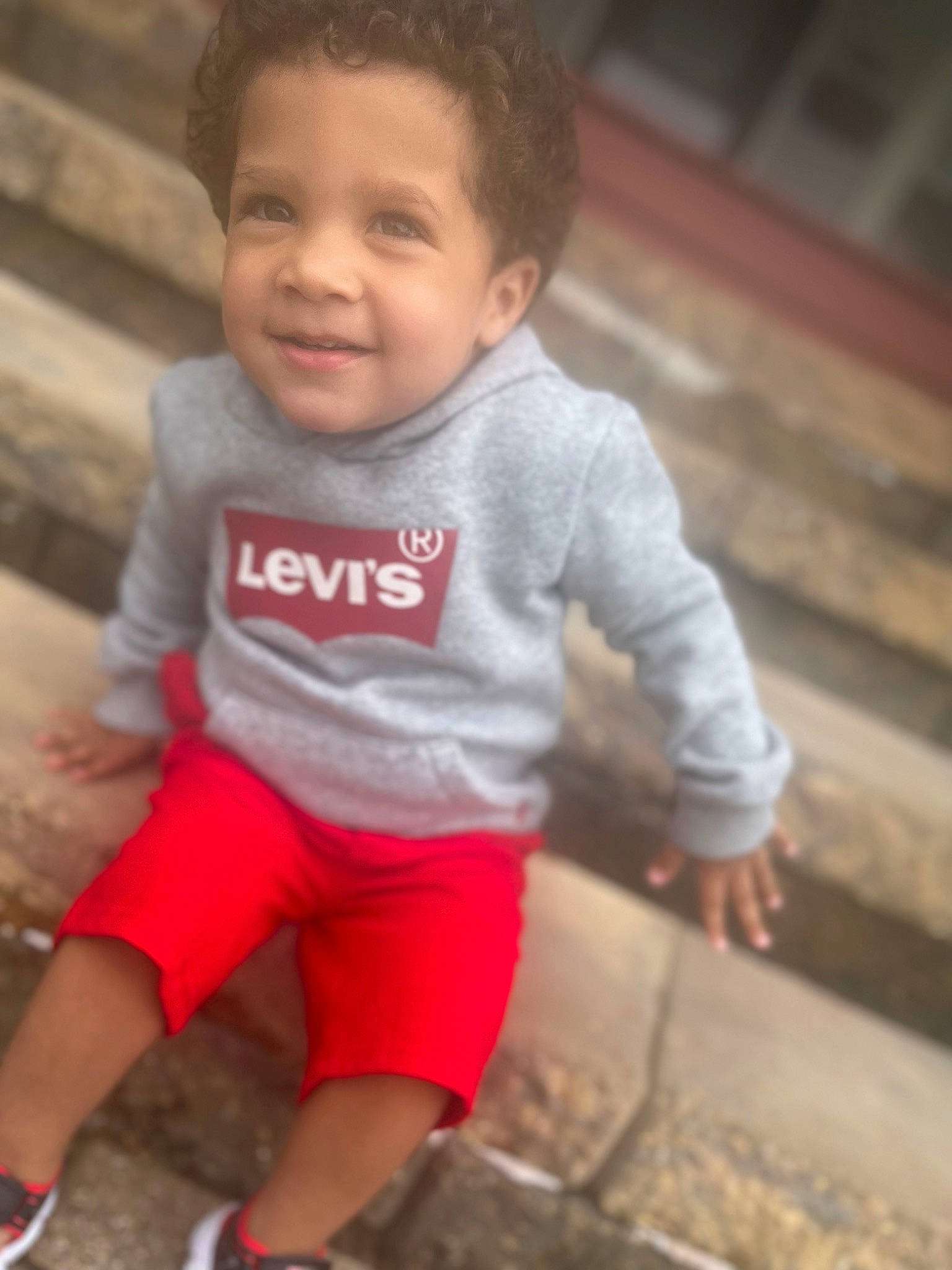 Julius is registered to the contest to win money with this photo: baby, baby_toddler_clothing, cheek, clothing, cool, dress, eye, hairstyle, happy, head, joy, mouth, nose, person, shorts, skin, sleeve, smile, standing, t_shirt
