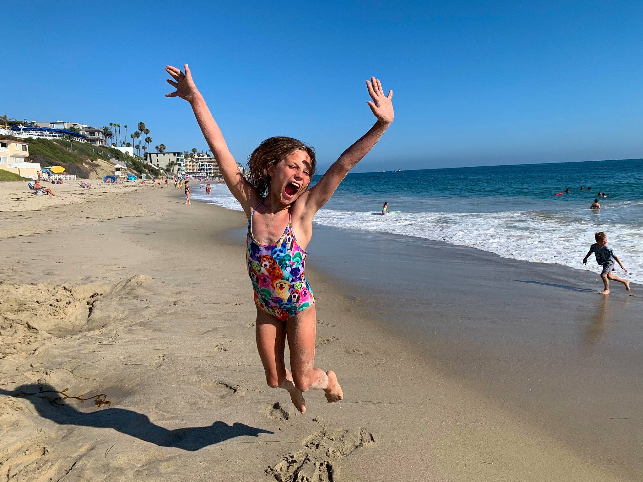 Milana is registered to the contest to win money with this photo: anger, barefoot, beach, bikini, finger, foot, fun, holiday, leisure, people_in_nature, people_on_beach, person, sand, shore, summer, swimsuit_bottom, swimsuit_top, swimwear, toe, tourism
