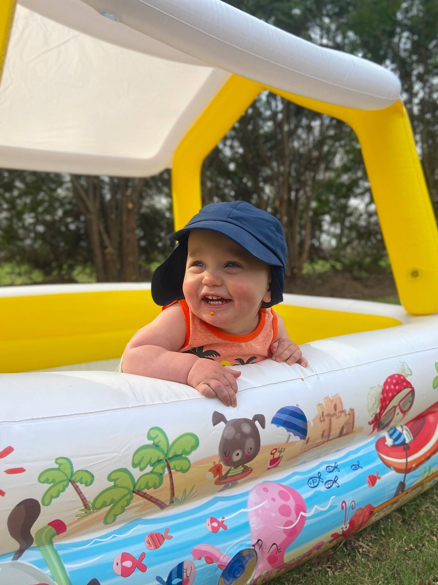 Archer joined the competition — help win amazing prizes! automotive_exterior, boats_and_boating_equipment_and_supplies, child, fun, grass, happy, hat, headwear, inflatable, joy, leisure, outdoor_play_equipment, person, personal_protective_equipment, product, recreation, smile, summer, toddler, tree