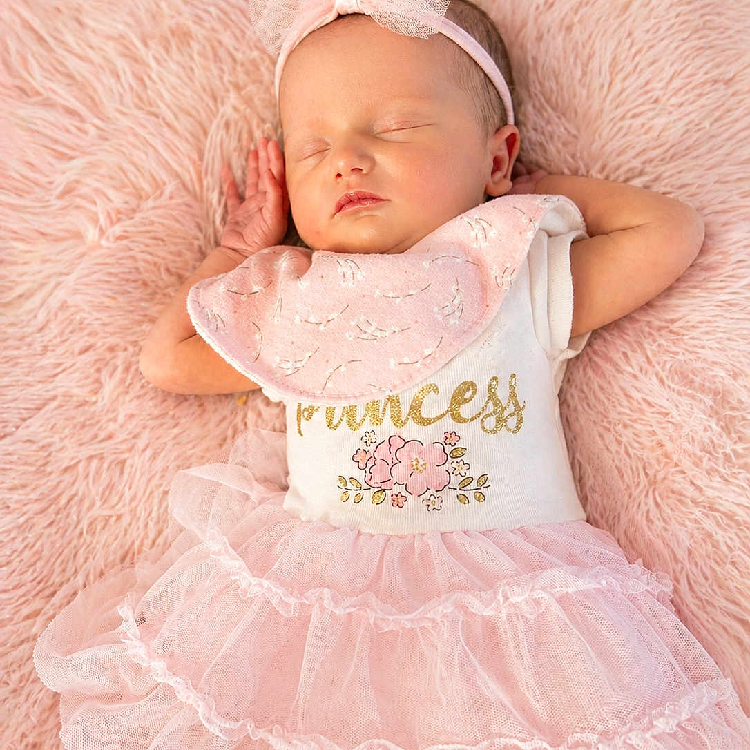 Lily is registered to the contest to win money with this photo: baby, sleeping, pink, tutu, headband, blanket, dress, infant, cute, child, soft, peaceful, adorable, portrait, resting, fashion, delicate, young, face, hands