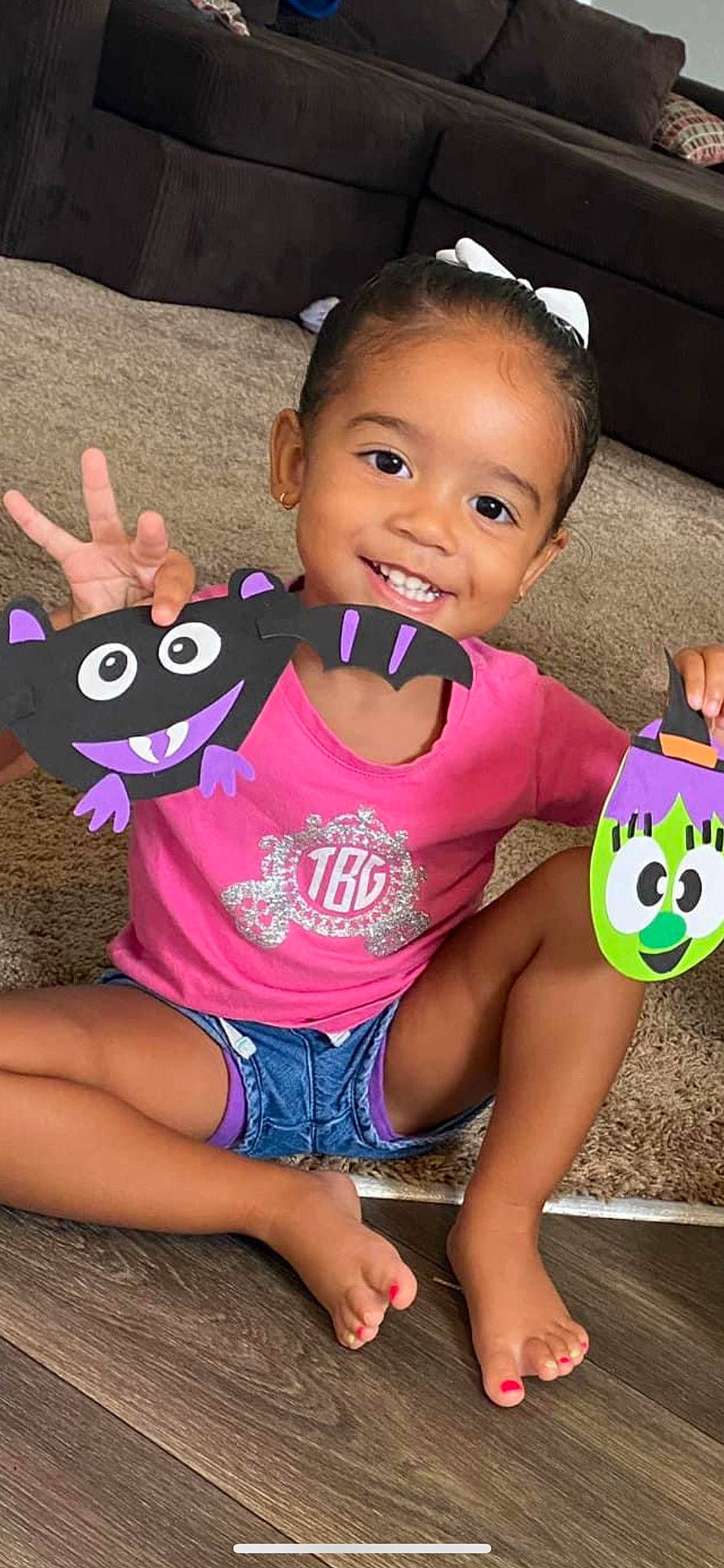 Teagan is registered to the contest to win money with this photo: arm, baby_toddler_clothing, cheek, child, clothing, cool, face, facial_expression, finger, hair, hand, happy, joy, mouth, organ, person, pink, skin, sleeve, smile