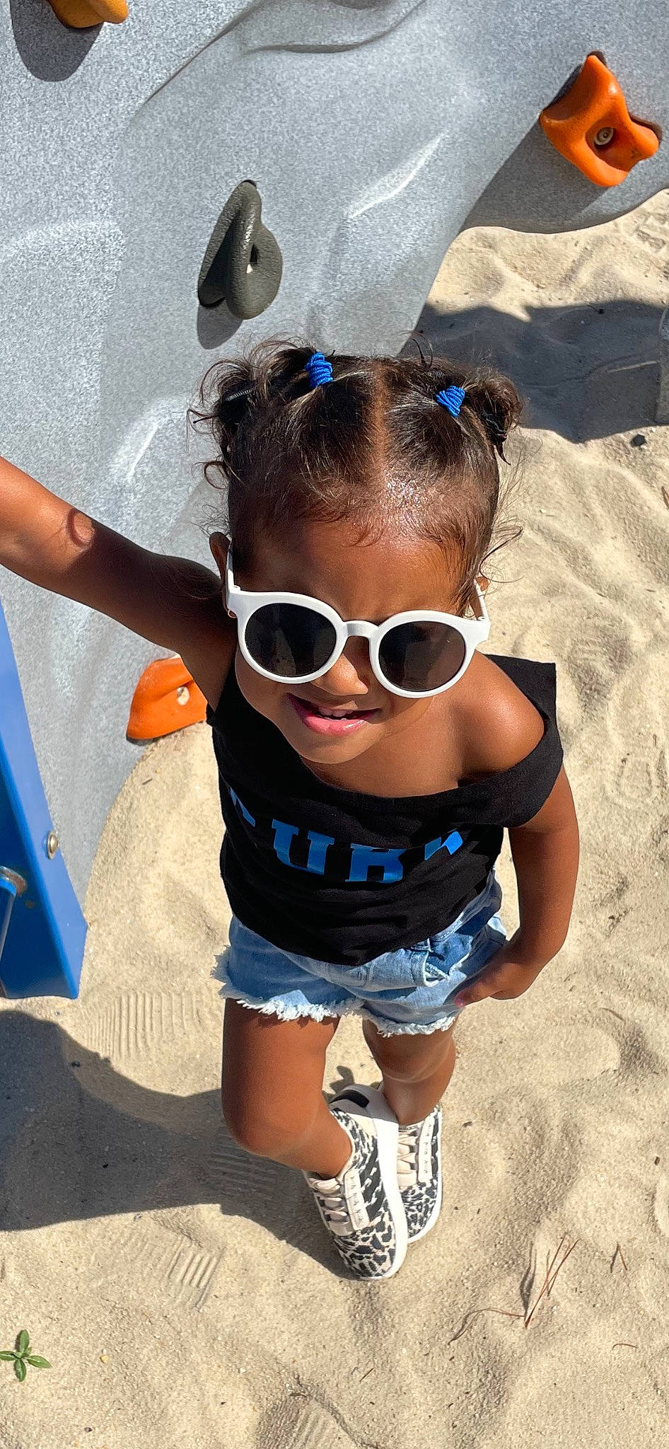 Teagan is registered to the contest to win money with this photo: azure, baby_toddler_clothing, blond, blue, child, cool, electric_blue, eyewear, fun, glasses, goggles, happy, headgear, leisure, person, personal_protective_equipment, shorts, sunglasses, thigh, toddler