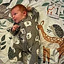 Rory is registered to the contest to win money with this photo: applique, baby, bed, bedroom, blanket, clothing, cushion, face, furniture, head, homedecor, indoors, linen, pattern, person, photography, portrait, quilt, room, t_shirt