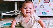 Prosper joined the competition — help win amazing prizes! baby, smiling, play_mat, indoor, child, face, happy, crawling, furniture, chair, fridge, stickers, floor, home, person, cute, infant, clothing, skin, expression
