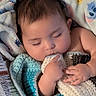 baby, sleeping, blanket, crocheted_blanket, hand, face, infant, cozy, soft_fabric, child, peaceful, cute, nap, indoors, portrait, wrapped, comfort, toddler, skin, closeup