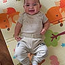 Prosper is registered to the contest to win money with this photo: baby, child, smiling, play_mat, colorful, animal_print, infant, clothing, socks, floor, wooden_floor, cute, happy, person, indoors, portrait, young_child, feet, hand, casual_wear