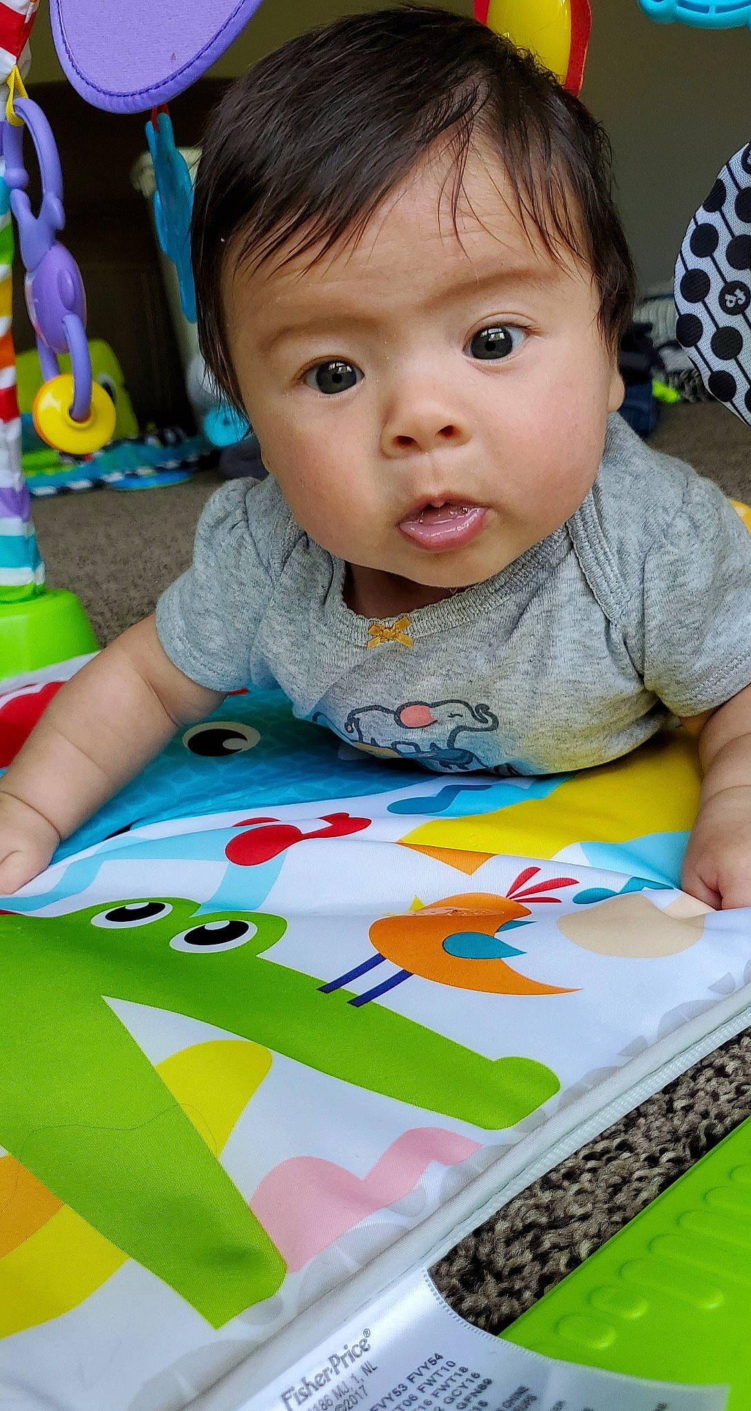 Kara joined the competition — help win amazing prizes! baby, baby_toys, cheek, child, leisure, person, play, playmat, surprise, textile, toddler, tummy_time