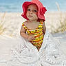 baby, child, hat, pink_hat, blanket, beach, ocean, sand, portrait, cute, outdoor, sunhat, lacy_blanket, infant, summer, clothing, person, young_child, sitting, nature