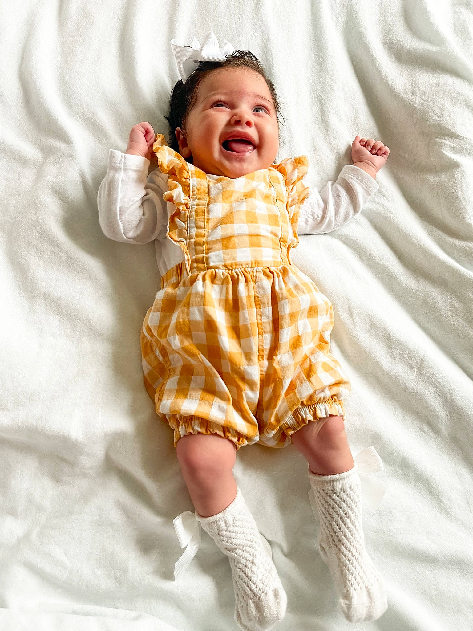 Delilah joined the competition — help win amazing prizes! arm, baby, baby_toddler_clothing, child, comfort, day_dress, eye, face, finger, happy, head, linens, one_piece_garment, pattern, person, pink, skin, sleeve, smile, textile