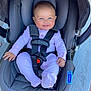 baby, infant, car_seat, graco, child, smiling, blue_eyes, pink_onesie, seatbelt, safety_harness, cute, happy, strapped_in, indoor, person, small_hands, footed_pajamas, headrest, baby_gear, child_safety