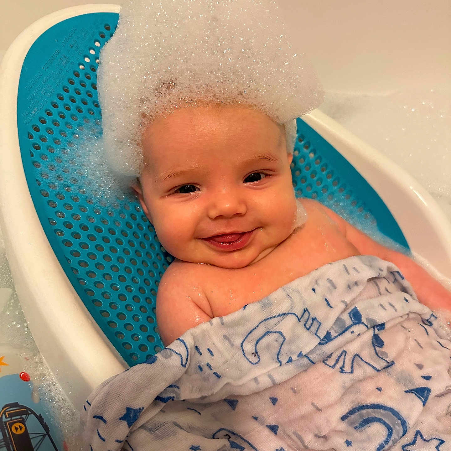 Isabella is registered to the contest to win money with this photo: baby, bathing, bathtub, face, happy, head, newborn, person, photography, portrait, smile, tub