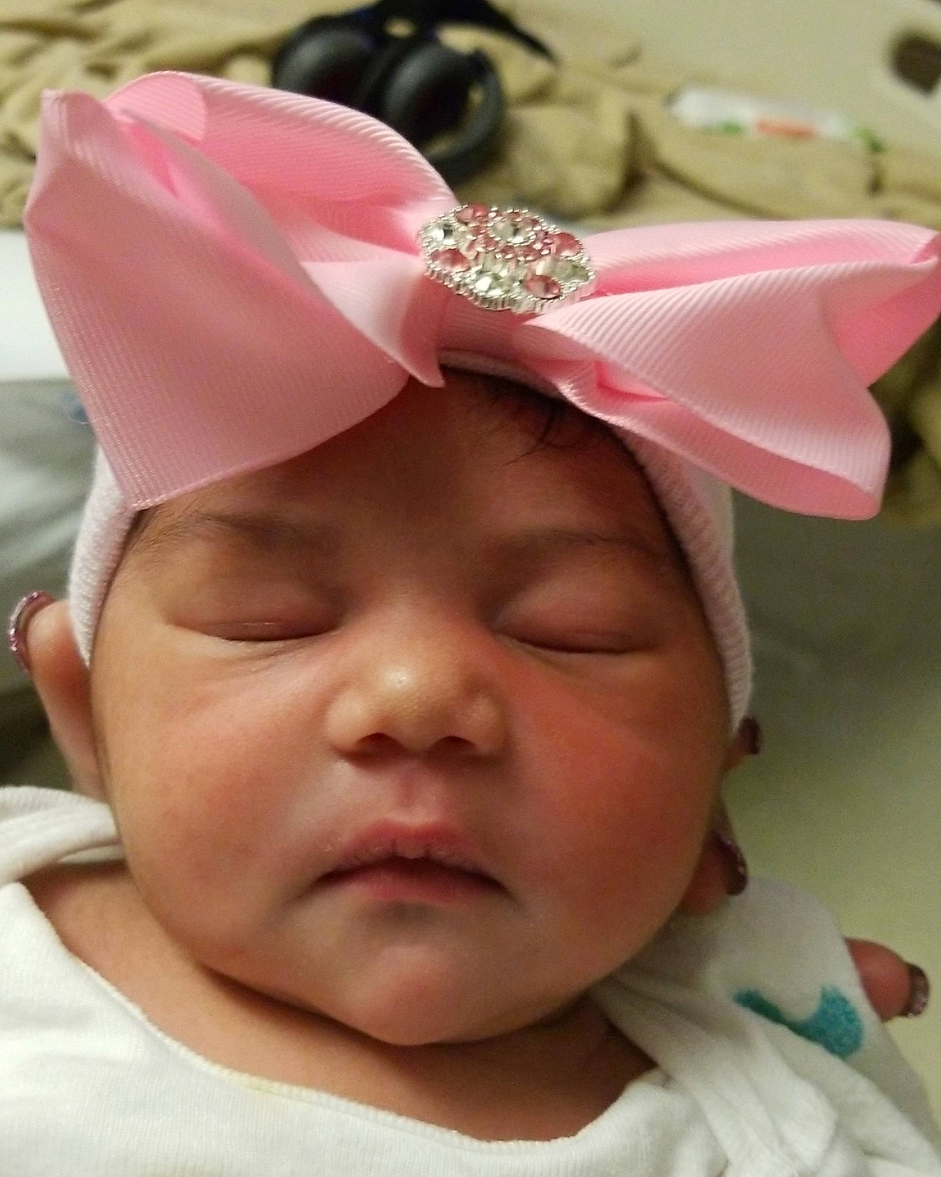 Ziyah is registered to the contest to win money with this photo: baby, cheek, child, fashion_accessory, hair_accessory, head, headgear, headpiece, person, pink, toddler