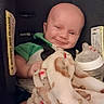 Sammuel is registered to the contest to win money with this photo: baby, blanket, bottle, car_seat, child, close_up, cozy, face, green_shirt, happy, head, indoor, infant, infant_care, nursery, photography, portrait, seated, smiling, vehicle
