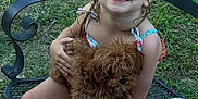 Nevaeh joined the competition — help win amazing prizes! child, puppy, dog, smiling, outdoor, grass, chair, towel, happy, cute, pet, summer, playful, young, sitting, person, nature, animal, friendship, fun