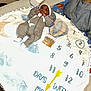 Jermaine joined the competition — help win amazing prizes! arrow, baby, baby_milestone, blanket, box, clothing, cord, cute, face, hat, indoor, infant, milestone_blanket, newborn, numbers, onesie, person, pillow, table, text