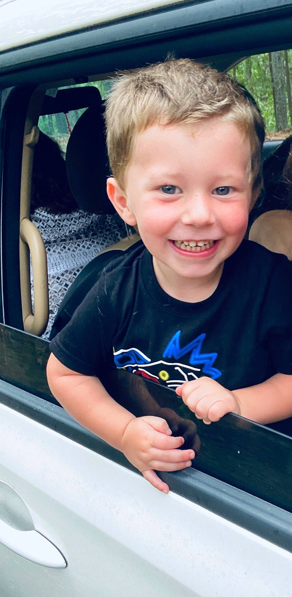 Dennis is registered to the contest to win money with this photo: active_shirt, automotive_window_part, baby_toddler_clothing, car_seat, car_seat_cover, child, cool, ear, hand, head_restraint, joy, laugh, person, seat_belt, smile, thumb, toddler, tooth, vehicle_door