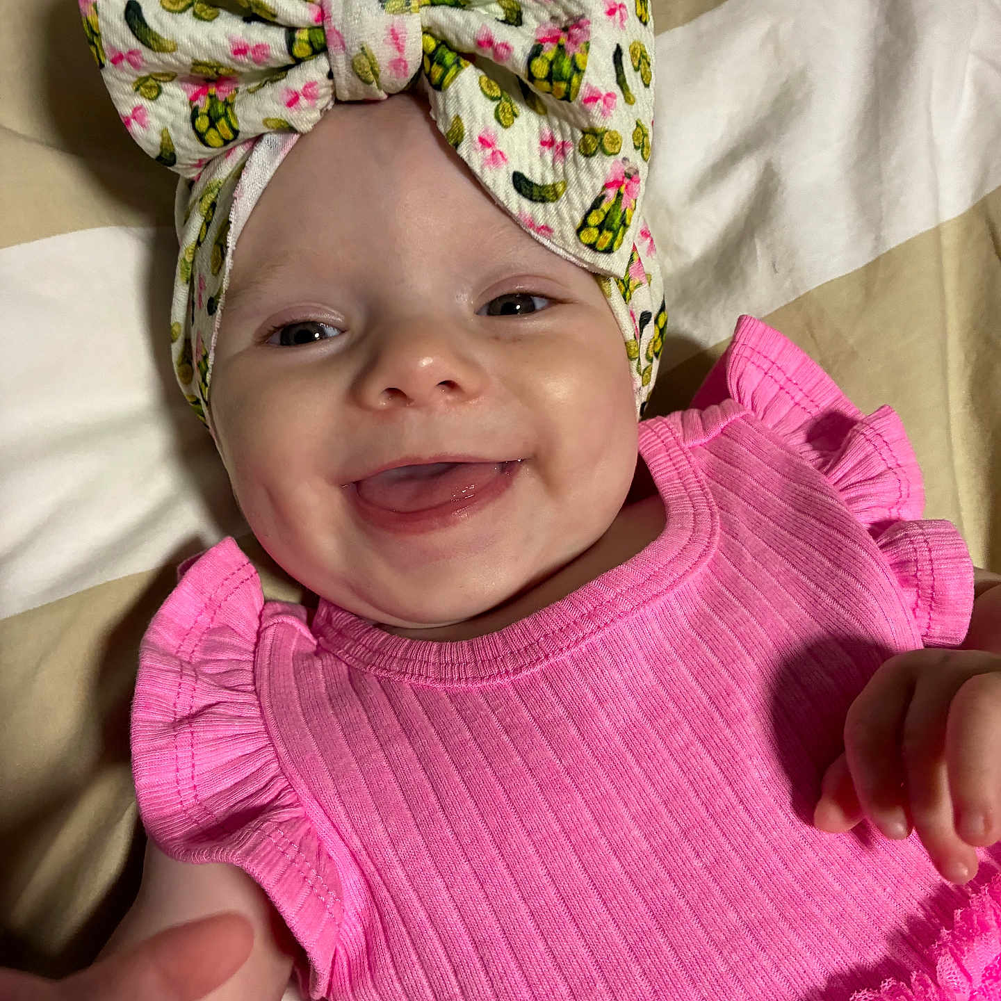 Gracie joined the competition — help win amazing prizes! baby, smile, headband, bow, pink_dress, ruffles, hand, face, infant, happy, closeup, child, cute, apparel, fabric, blanket, indoors, skin, portrait, person