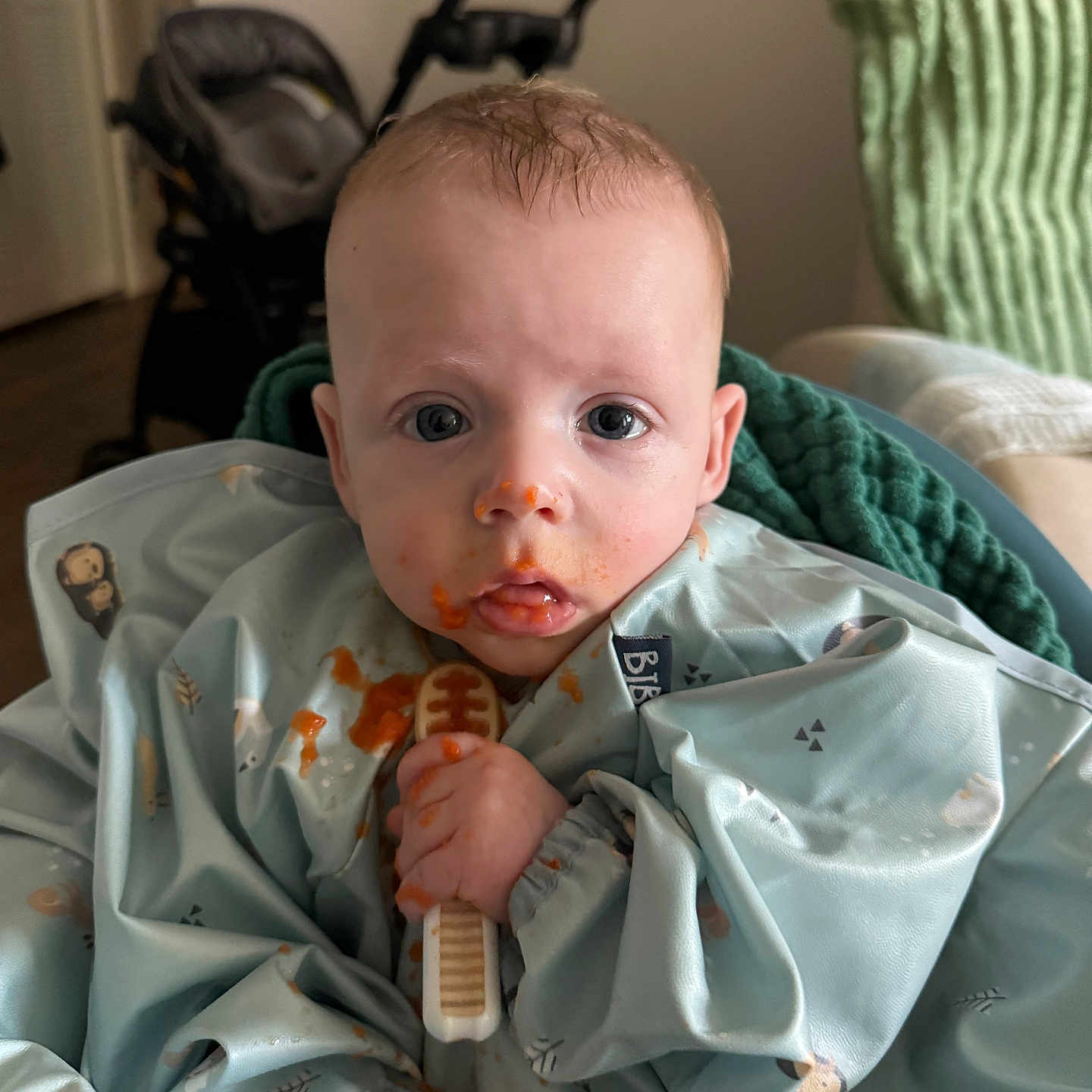 Mayer joined the competition — help win amazing prizes! baby, bib, blanket, blue_clothing, child, curious_eyes, face, food_stains, hand, home, indoor, infant, messy_face, mouth, person, portrait, sitting, stroller, teething_toy, young_child