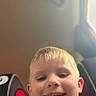 Owyn joined the competition — help win amazing prizes! child, boy, face, smile, selfie, car_seat, interior, window, blurry_background, casual, happy, young, portrait, indoor, seat, clothing, head, person, light, candid
