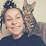 Waffles joined the competition — help win amazing prizes! black_tshirt, cat, curly_hair, ear_gauges, filter, hairstyle, happy, indoor, kitten, moon_filter, nose_ring, person, pet, piercing, shoulder_perch, smiling, star_filter, tabby_cat, tattoo, text_on_clothing