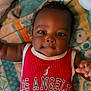 Wesley joined the competition — help win amazing prizes! baby, infant, child, red_jersey, los_angeles, number_22, blanket, curly_hair, smiling, cute, lying_down, indoors, soft_toys, colorful_blanket, portrait, chubby_cheeks, happy, playful, person, young_child