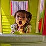 Théa a rejoint le concours — aidez-le/la à gagner de superbes lots ! child, colorful, cute, fun, green, happy, open_mouth, outdoor, person, pigtails, plastic, play, playhouse, red, smiling, sunlight, toddler, toy, window, yellow