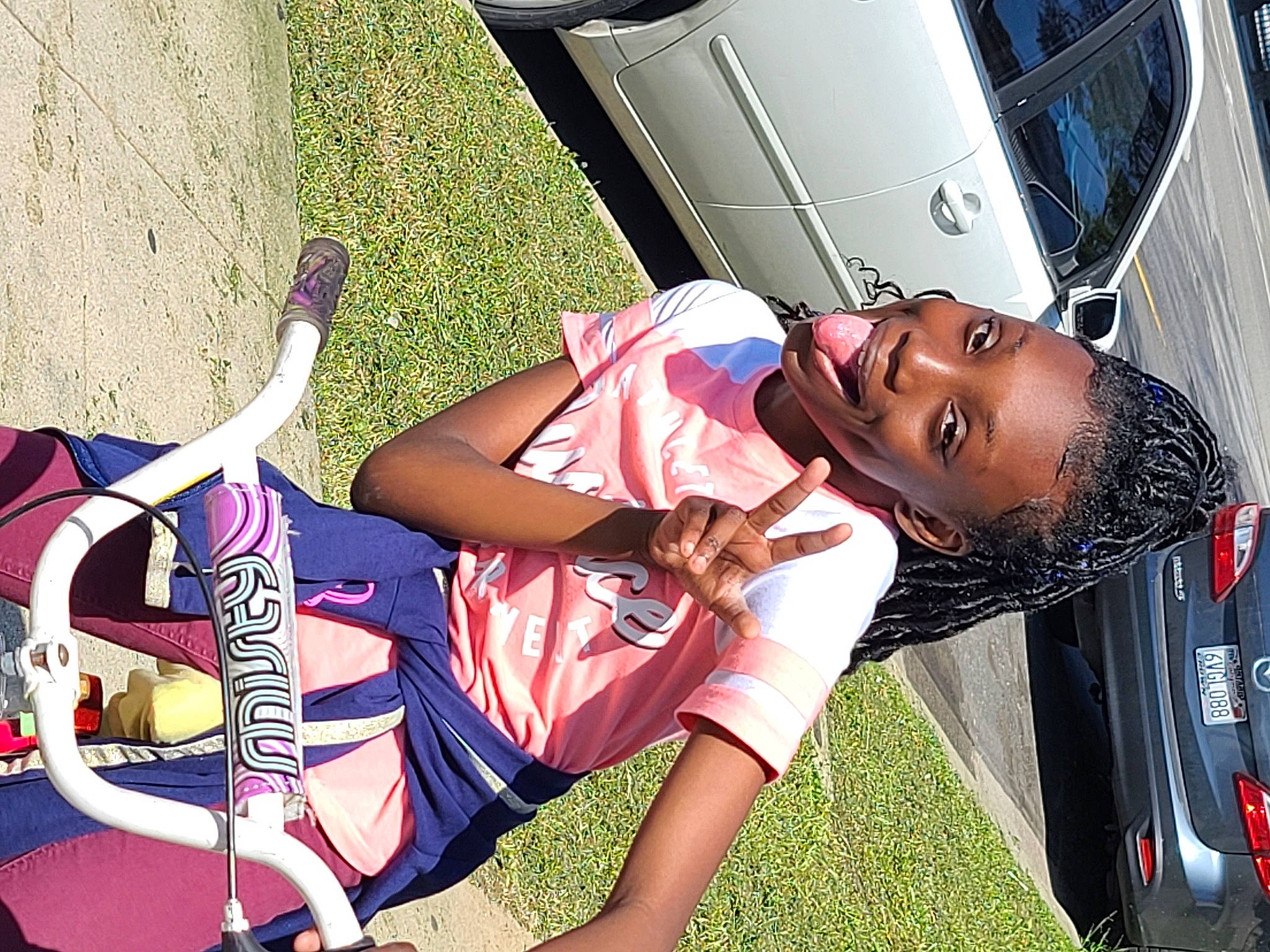 Trinitee is registered to the contest to win money with this photo: arm, black_hair, child, cool, fun, happy, joy, leg, leisure, mouth, person, pink, recreation, summer, tourism, tree, vacation